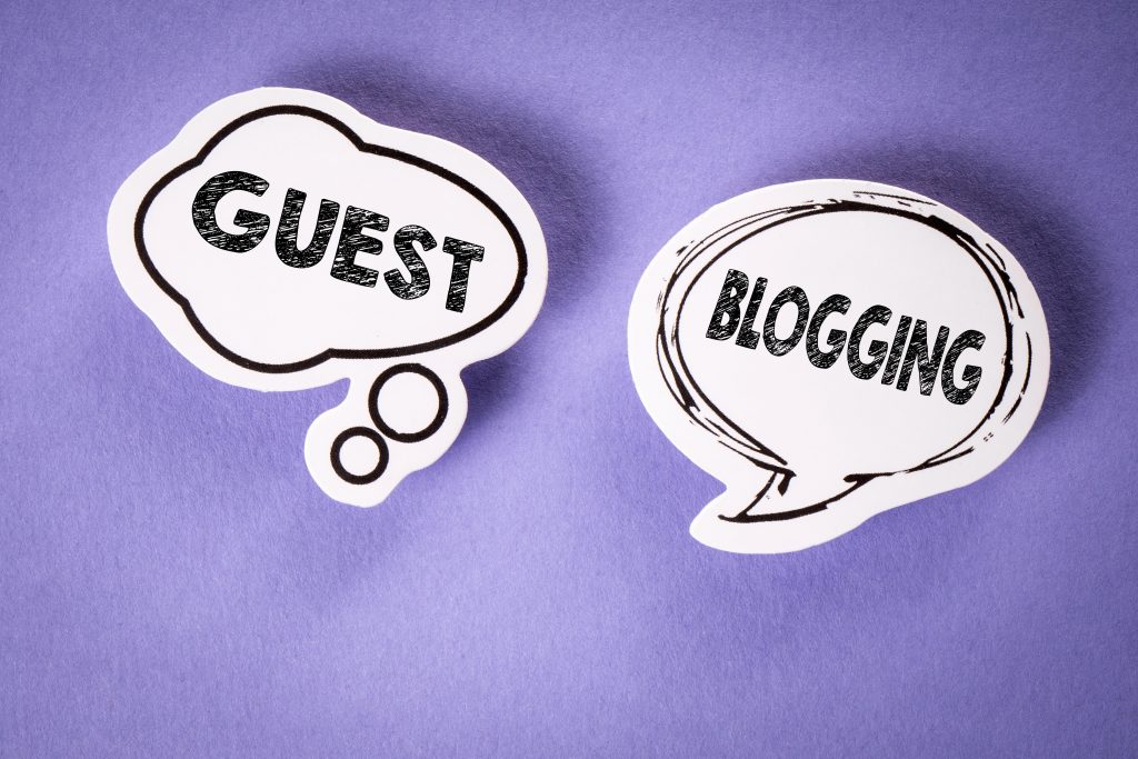 The image shows two speech bubbles on a purple background. The first bubble on the left reads "GUEST BLOG" and the second on the right reads "POSTING." Both are in black text on a white background, emphasizing the dynamic exchange of ideas in the world of blogging. - Ketamine